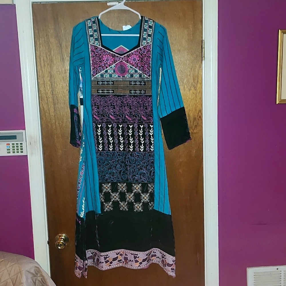 NEW HAND MADE INTRICATE, WOMEN'S BODY LENGTH DRESS. THE SIDES ARE SLIT UP LEGS.